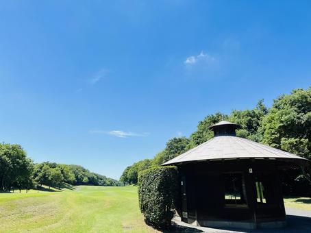 A view of a gazebo on a golf course and the blue sky, JPG A view of a gazebo on a golf course and the blue sky, JPG