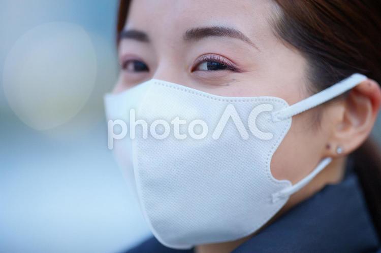 マスクしている女性のアップ 女性,マスク,アップの写真素材