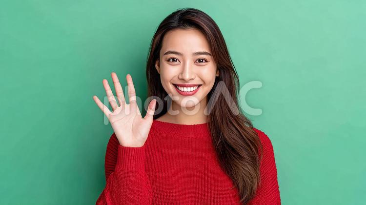 笑顔で手を振る女性 女性,韓国人,アジア人の写真素材