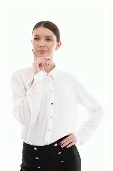 A woman in a thinking pose with her hands on her hips, JPG A woman in a thinking pose with her hands on her hips, JPG