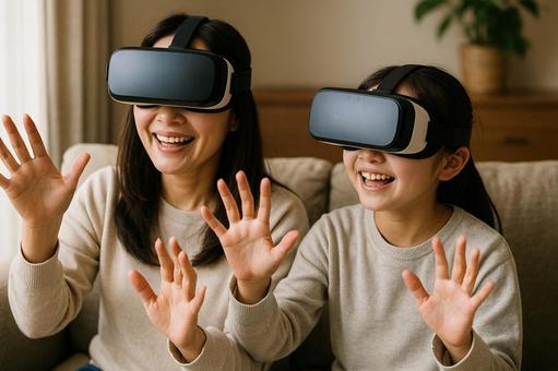 VRゴーグルで遊ぶ母と娘、楽しい休日 VRゴーグルで遊ぶ母と娘、楽しい休日の写真
