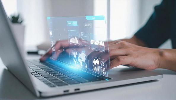 ホログラムとPC作業をする手元 ホログラムとPC作業をする手元の写真