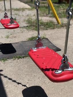 Cute red swing in the park, JPG
