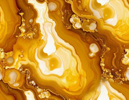 琥珀色鉱石と金の粒模様の写真