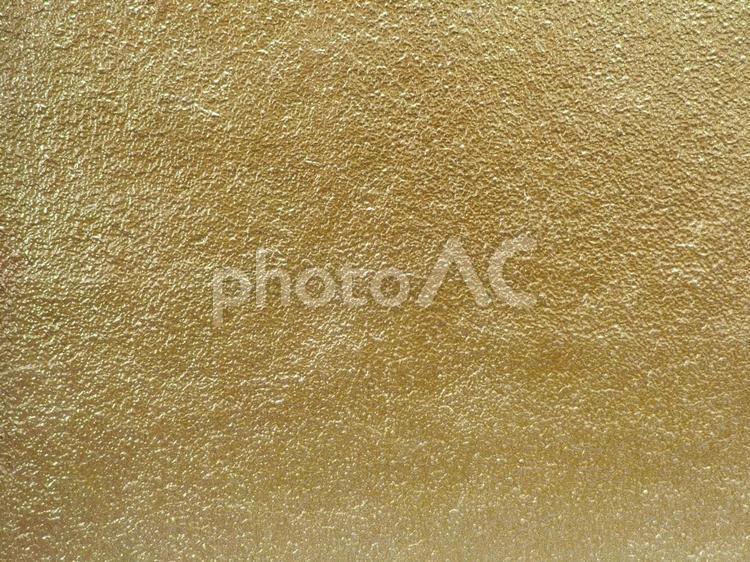 凸凹したコンクリートの壁の表面 金色 金色,ゴールド,黄色の写真素材