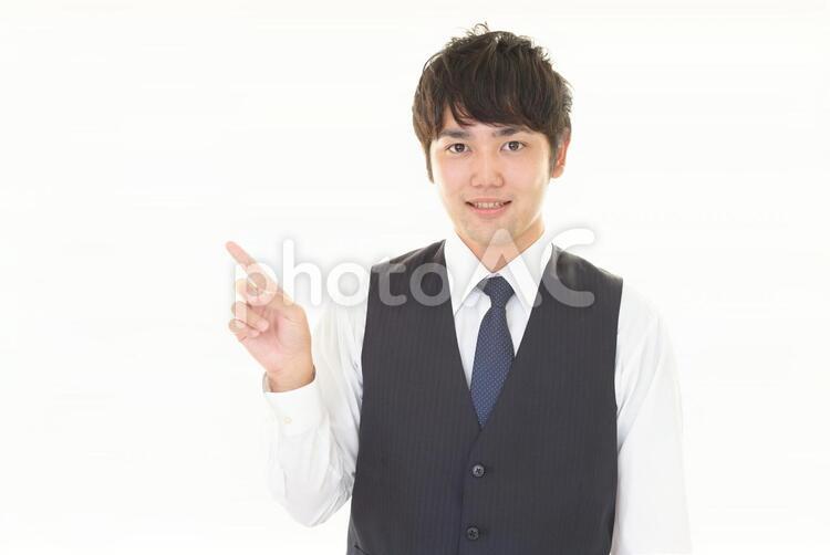 指示する笑顔のビジネスマン 男性,ビジネスマン,男の写真素材