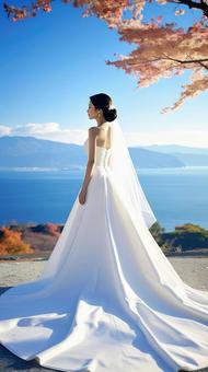 秋の紅葉の中のウェデイングドレス姿の花嫁 秋の紅葉の中のウェデイングドレス姿の花嫁の写真