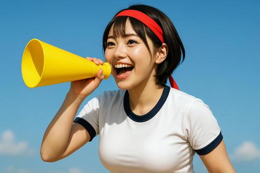 黄色のメガホンで応援する女子高生 黄色のメガホンで応援する女子高生の写真