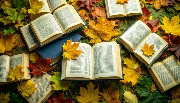 読書の秋 机の上の本 落ち葉の紅葉 読書の秋 机の上の本 落ち葉の紅葉の写真