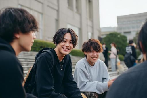 A group of male university students chatting on campus, college students, male college student, student, JPG