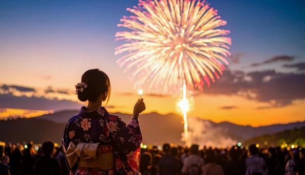 打ち上げ花火を見る女性 打ち上げ花火を見る女性の写真