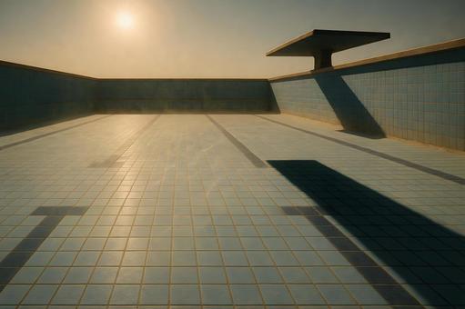 朝日に照らされた空のプールの写真