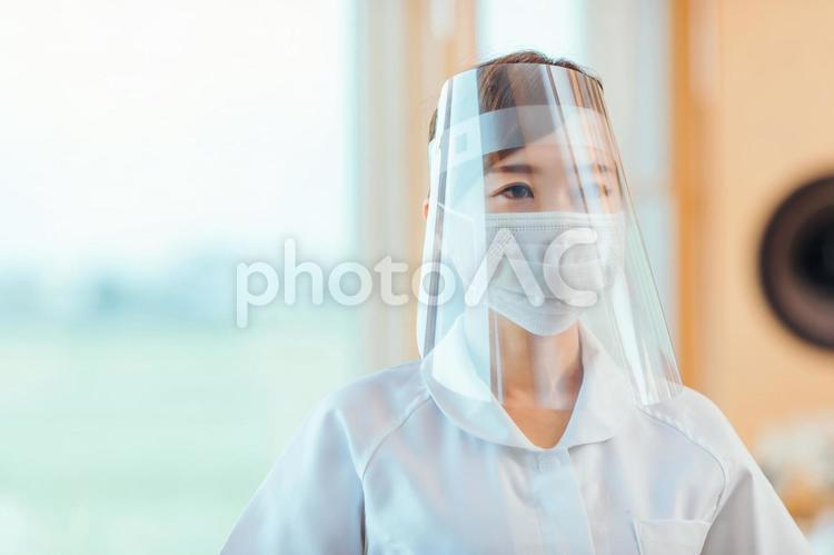 ファイスシールドをした看護師 フェイスシールド,看護師,ナースの写真素材