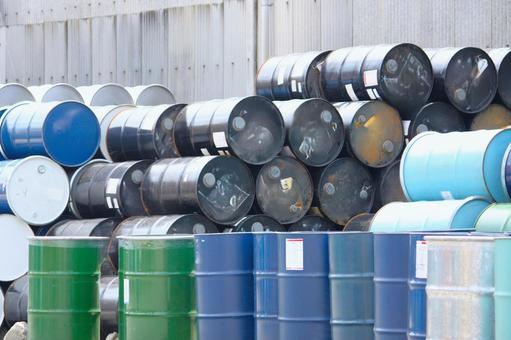 Drums stacked in the vacant lot in front of the warehouse, JPG