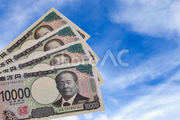 青空と1万円札 1万円,お札,一万円札の写真素材