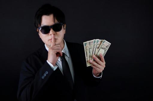 お金と秘密の男性 お金と秘密の男性 男性,お金,秘密の写真素材