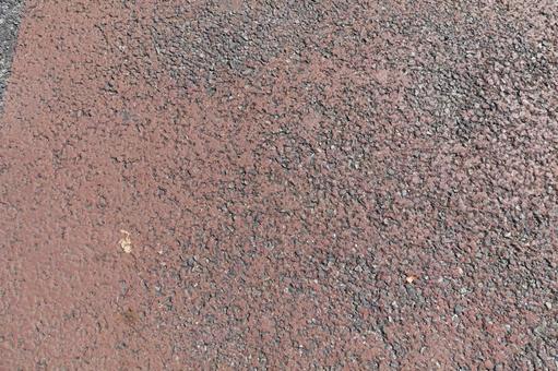 粒状の赤茶色の舗装材のテクスチャ  テクスチャ,背景,壁紙の写真素材