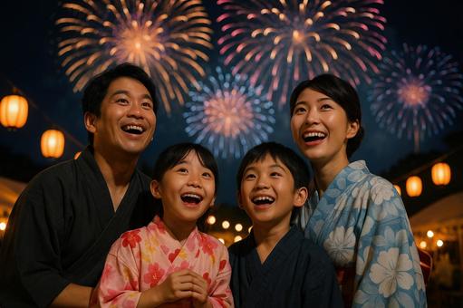 花火を見て歓声を上げる日本人家族 花火を見て歓声を上げる日本人家族の写真