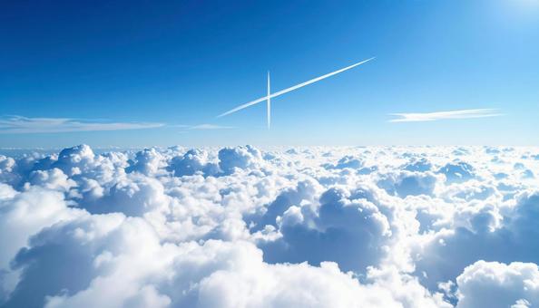 飛行機雲と青空の写真