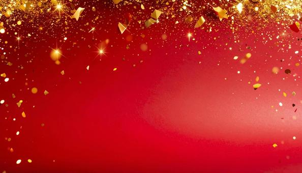 金の紙吹雪や金粉が舞う赤い背景素材の写真