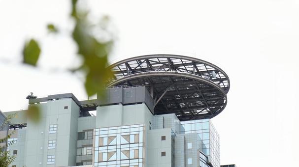 木陰から見るTBSビッグハットの風景 木陰から見るTBSビッグハットの風景 tbs,風景,木陰の写真素材