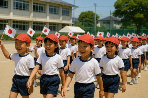 運動会の入場行進をする小学1年生 運動会の入場行進をする小学1年生の写真