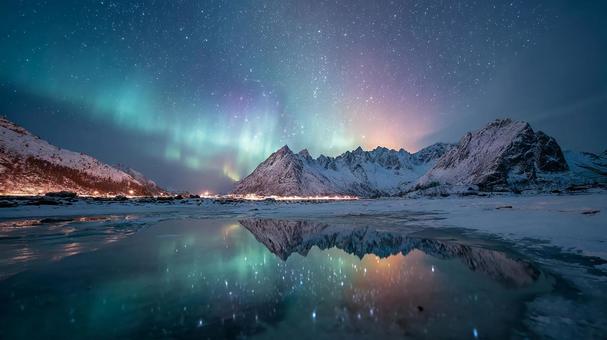 満天の星空と光り輝くオーロラ 満天の星空と光り輝くオーロラの写真