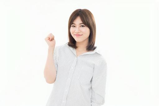 若い女性 ガッツポーズ 若い女性 ガッツポーズの写真