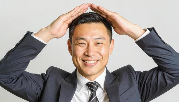 丸のポーズをする日本人サラリーマン 丸のポーズをする日本人サラリーマンの写真