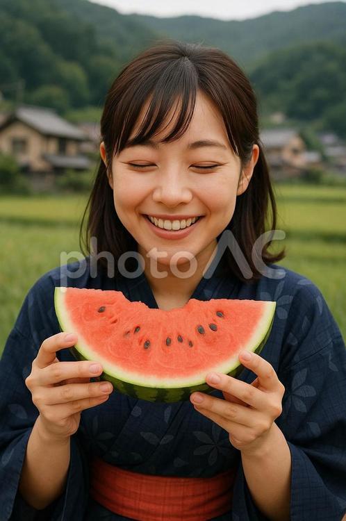 お盆帰りで美味しくスイカを食べる 女性,8月,自然の写真素材