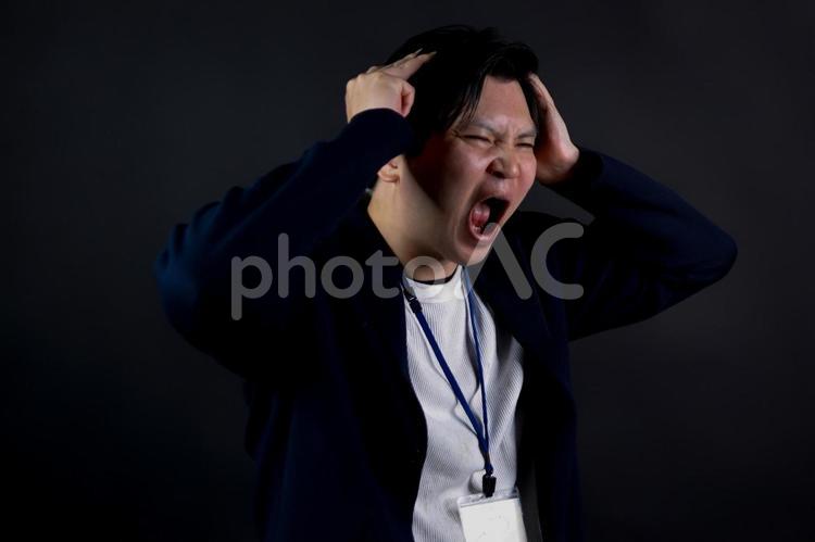 怒りの表情の男性 男性,怒り,表情の写真素材