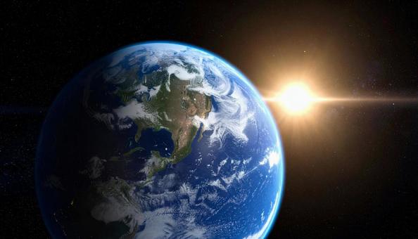 宇宙空間　地球と太陽の写真