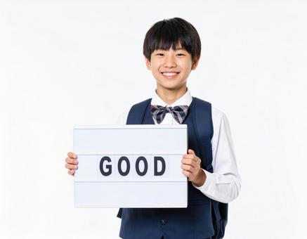 GOODと書いたボードをもつ生徒 GOODと書いたボードをもつ生徒の写真