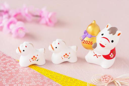 2026の金ひょうたんを持つ馬の年賀素材 2026の金ひょうたんを持つ馬の年賀素材 年賀状,午,年賀状背景の写真素材