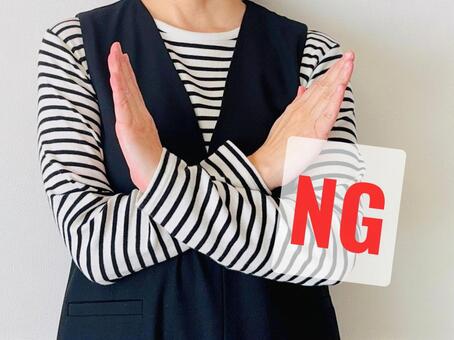 A woman making a NG/X pose, JPG A woman making a NG/X pose, JPG