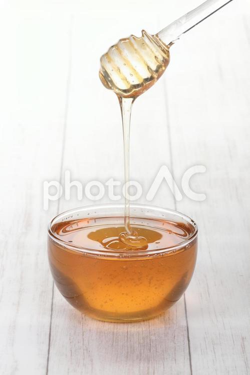 甘いはちみつをトングですくう はちみつ,トング,蜂蜜の写真素材