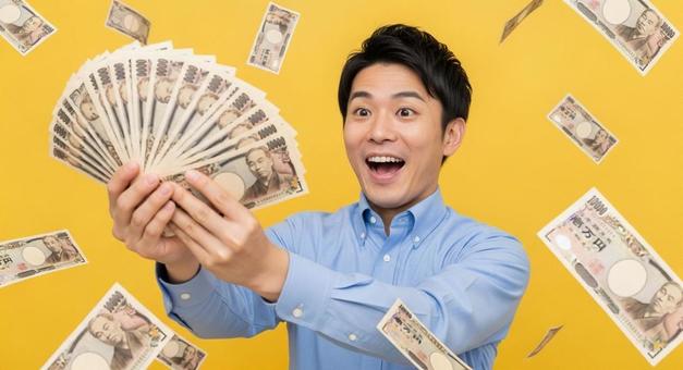 大金を手にして喜ぶ男性 大金を手にして喜ぶ男性の写真