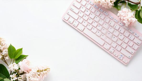 ピンク色のキーボードと花 ピンク色のキーボードと花の写真