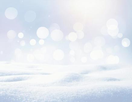 雪と光のボケが輝く冬の幻想的背景 雪と光のボケが輝く冬の幻想的背景の写真