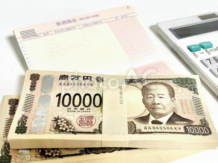 帯付きの紙幣と通帳 紙幣,帯付,現金の写真素材