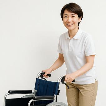 車椅子とヘルパーの写真