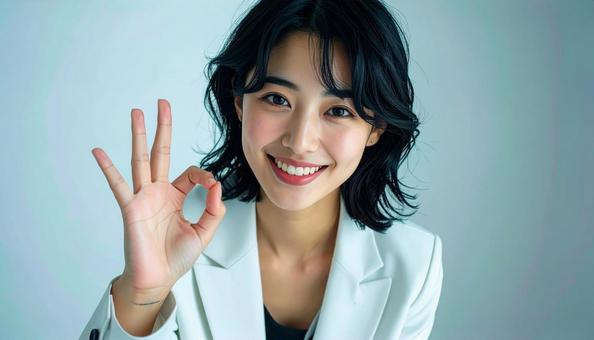 OKサインをする女性 OKサインをする女性の写真