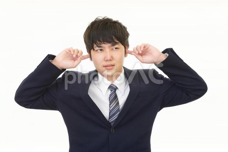 耳を塞ぐ男性 男性,ビジネスマン,男の写真素材