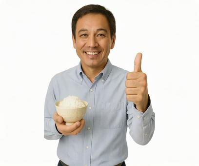 笑顔で茶碗のごはんを持つ男性のいいねの指 笑顔で茶碗のごはんを持つ男性のいいねの指の写真