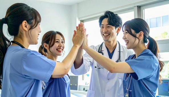 喜びを分かち合う看護師・医者 喜びを分かち合う看護師・医者の写真