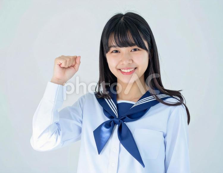 ガッツポーズをする女子生徒のイメージ ガッツポーズ,女の子,元気の写真素材