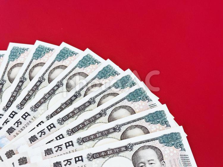 扇状に並べられた1万円札 お金,赤字,紙幣の写真素材