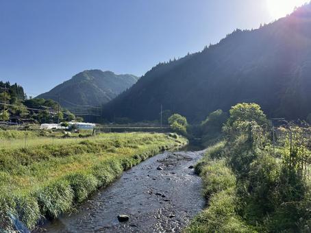 The murmuring of a river surrounded by greenery, JPG