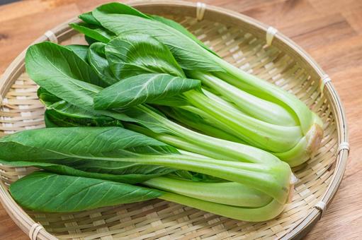 Bok choy arranged on a bamboo basket, JPG