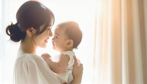 見つめ合う母親と赤ちゃん 見つめ合う母親と赤ちゃんの写真